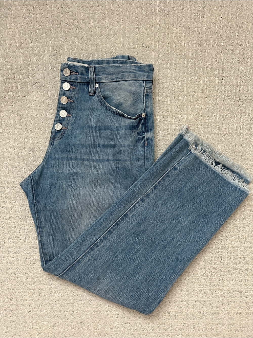 High-Rise Light Blue Button-Fly Jeans with Frayed Hem